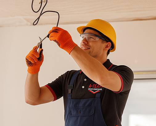 Electrician protective gear working on ceiling wires